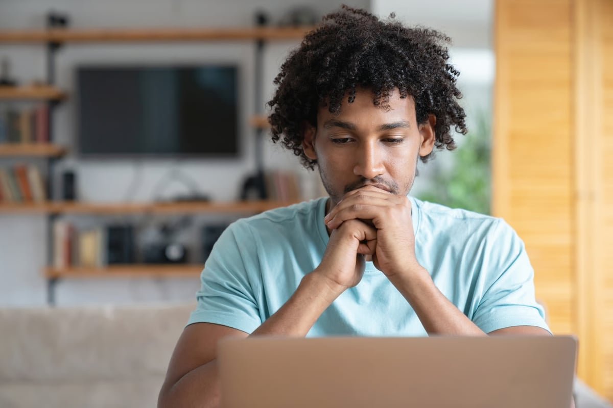 Person looking at laptop.