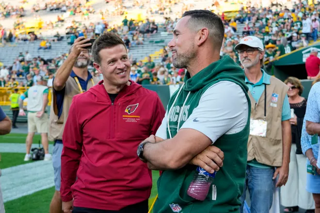 Aug 28, 2026; Green Bay, Wisconsin, USA;  Arizona Cardinals head coach Mike LaFleur talks with Green Bay Packers head coach Matt LaFleur prior to the game at Lambeau Field. Mandatory Credit: Jeff Hanisch-Imagn Images