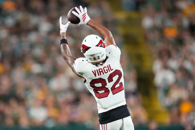 Aug 28, 2026; Green Bay, Wisconsin, USA;  Arizona Cardinals wide receiver Reggie Virgil (82) catches a pass during the second quarter against the Green Bay Packers at Lambeau Field. Mandatory Credit: Jeff Hanisch-Imagn Images