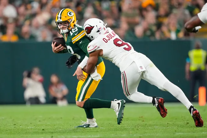 Aug 28, 2026; Green Bay, Wisconsin, USA;  Arizona Cardinals wide receiver Ihmir Smith-Marsette (9) chases Green Bay Packers quarterback Kyle McCord (18) during the third quarter at Lambeau Field. Mandatory Credit: Jeff Hanisch-Imagn Images
