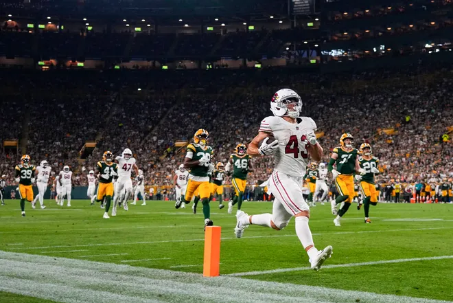 Aug 28, 2026; Green Bay, Wisconsin, USA;  Arizona Cardinals running back Evan Hull (43) rushes for a touchdown during the second quarter against the Green Bay Packers at Lambeau Field. Mandatory Credit: Jeff Hanisch-Imagn Images