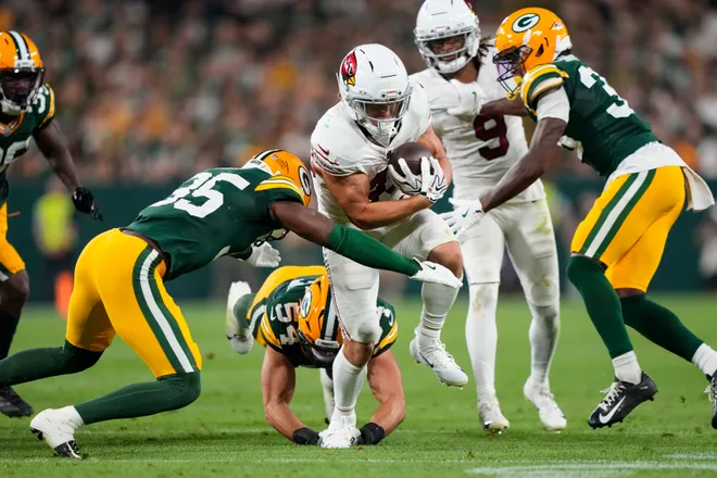 Aug 28, 2026; Green Bay, Wisconsin, USA;  Arizona Cardinals running back Evan Hull (43) rushes with the football during the third quarter against the Arizona Cardinals at Lambeau Field. Mandatory Credit: Jeff Hanisch-Imagn Images