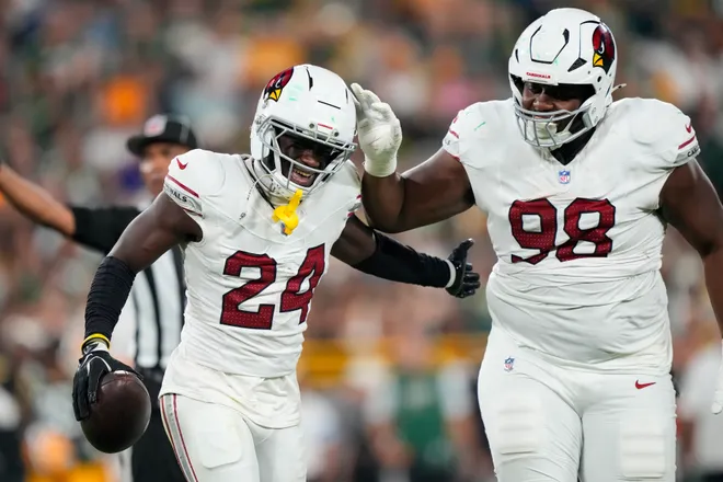 Aug 28, 2026; Green Bay, Wisconsin, USA;  Arizona Cardinals cornerback Starling Thomas V (24) celebrates with defensive tackle Brodric Martin-Rhodes (98) after recovering a fumble during the third quarter against the Green Bay Packers at Lambeau Field. Mandatory Credit: Jeff Hanisch-Imagn Images