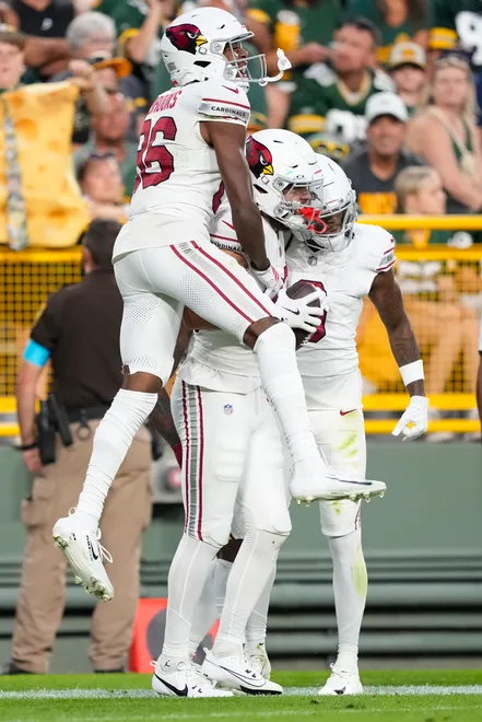 Aug 28, 2026; Green Bay, Wisconsin, USA;  Arizona Cardinals wide receiver Simi Fehoko (80) celebrates with wide receiver Jalen Brooks (86) following a touchdown during the second quarter against the Green Bay Packersat Lambeau Field. Mandatory Credit: Jeff Hanisch-Imagn Images