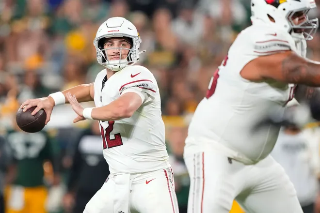 Aug 28, 2026; Green Bay, Wisconsin, USA;  Arizona Cardinals quarterback Kedon Slovis (12) throws a pass during the fourth quarter against the Green Bay Packers at Lambeau Field. Mandatory Credit: Jeff Hanisch-Imagn Images