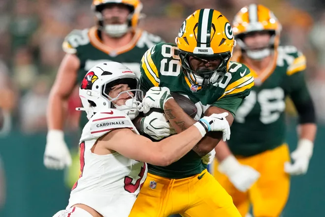 Aug 28, 2026; Green Bay, Wisconsin, USA;  Green Bay Packers wide receiver Kaden Prather (89) is tackled by Arizona Cardinals safety Hudson Clark (37) during the fourth quarter at Lambeau Field. Mandatory Credit: Jeff Hanisch-Imagn Images