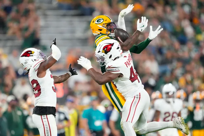 Aug 28, 2026; Green Bay, Wisconsin, USA;  Arizona Cardinals inside linebacker Owen Pappoe (44) breaks up the pass intended for Green Bay Packers wide receiver Chris Hilton Jr. (37) during the fourth quarter at Lambeau Field. Mandatory Credit: Jeff Hanisch-Imagn Images