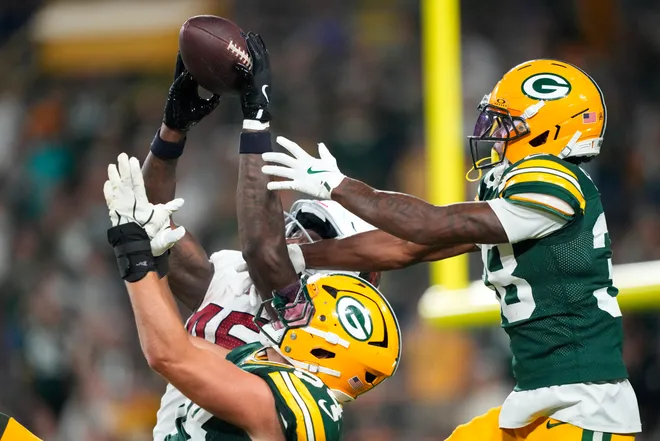 Aug 28, 2026; Green Bay, Wisconsin, USA;  Arizona Cardinals tight end Rivaldo Fairweather (45) tries catching a Hail Mary pass at the end of the fourth quarter against Green Bay Packers cornerback Jaylin Simpson (38) and linebacker Kristian Welch (54) at Lambeau Field. Mandatory Credit: Jeff Hanisch-Imagn Images