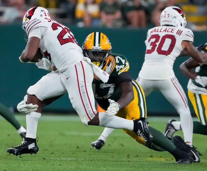 Green Bay Packers defensive end Nyjalik Kelly (47) tackles Arizona Cardinals running back Tre Stewart (26) during their preseason football game on Friday, Aug. 28, 2026, at Lambeau Field in Green Bay, Wisconsin. The Packers won the game, 42-38.
Tork Mason/Green Bay Press-Gazette