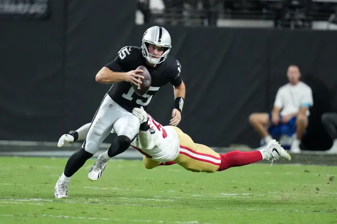 Aug 27, 2026; Paradise, Nevada, USA; Las Vegas Raiders quarterback Fernando Mendoza (15) carries the ball against San Francisco 49ers linebacker Jaden Dugger (53) at Allegiant Stadium. Mandatory Credit: Kirby Lee-Imagn Images