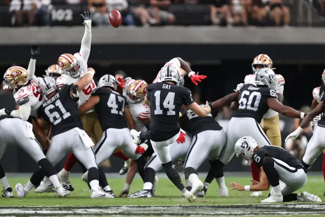 Aug 27, 2026; Paradise, Nevada, USA; Las Vegas Raiders placekicker Matt Gay (14) kicks a forty-five yard field goal held by punter AJ Cole (6) against the San Francisco 49ers during the second quarter at Allegiant Stadium. Mandatory Credit: Christopher Trim-Imagn Images