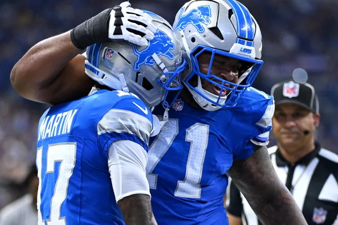 Aug 29, 2026; Indianapolis, Indiana, USA;  Detroit Lions wide receiver Tay Martin (17) and guard Miles Frazier (71) celebrate after after a touchdown against the Indianapolis Colts during the first half at Lucas Oil Stadium.  Mandatory Credit: Robert Goddin-Imagn Images