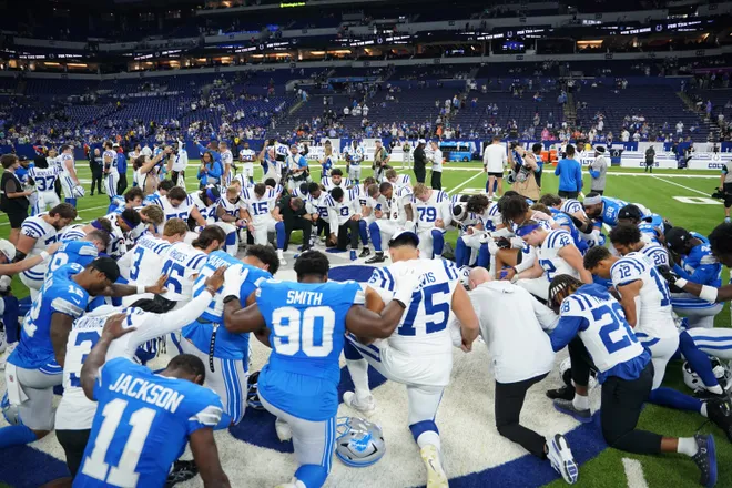 Aug 29, 2026; Indianapolis, Indiana, USA;  The Detroit Lions and Indianapolis Colts kneel at mid field after the game at Lucas Oil Stadium.  Mandatory Credit: Robert Goddin-Imagn Images