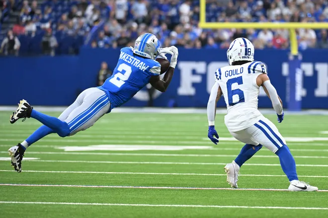 Aug 29, 2026; Indianapolis, Indiana, USA;  Detroit Lions cornerback Ennis Rakestraw Jr. (2) leaps for the ball against Indianapolis Colts wide receiver Anthony Gould (6) during the first half at Lucas Oil Stadium.  Mandatory Credit: Robert Goddin-Imagn Images