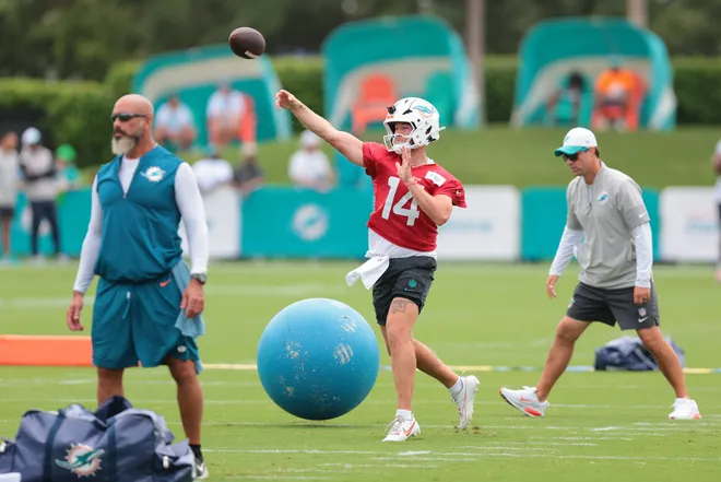 Aug 2, 2026; Miami Gardens, FL, USA; Miami Dolphins quarterback Quinn Ewers (14) throws the football during practice at Baptist Health Training Complex. Mandatory Credit: Sam Navarro-Imagn Images