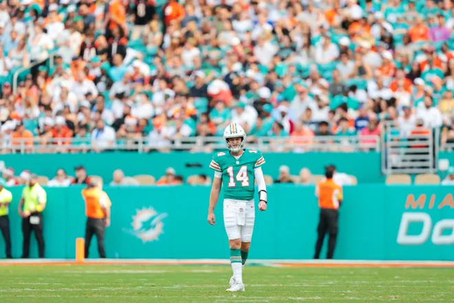 Dec 21, 2025; Miami Gardens, Florida, USA; Miami Dolphins quarterback Quinn Ewers (14) walks on the field during the second quarter against the Cincinnati Bengals at Hard Rock Stadium. Mandatory Credit: Sam Navarro-Imagn Images