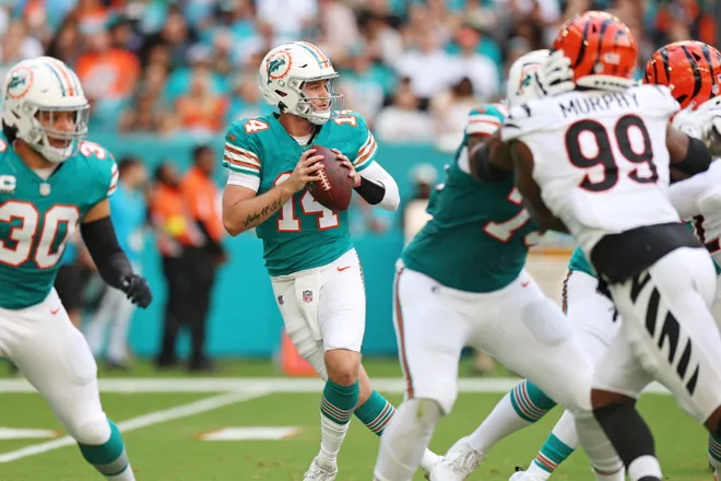 Dec 21, 2025; Miami Gardens, Florida, USA; Miami Dolphins quarterback Quinn Ewers (14) drops back to make a pass during the second quarter against the Cincinnati Bengals at Hard Rock Stadium. Mandatory Credit: Nathan Ray Seebeck-Imagn Images