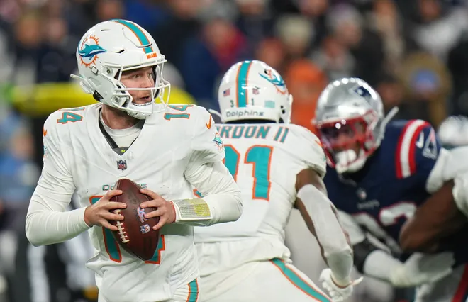 Jan 4, 2026; Foxborough, Massachusetts, USA; Miami Dolphins quarterback Quinn Ewers (14) drops back to pass against the New England Patriots during the second half at Gillette Stadium. Mandatory Credit: David Butler II-Imagn Images