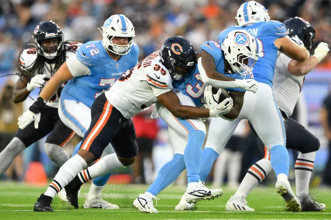 Aug 29, 2026; Nashville, Tennessee, USA;  Chicago Bears linebacker Wayne Matthews III (35) tackles Tennessee Titans running back Michael Carter (35) during the third quarter at Nissan Stadium.  Mandatory Credit: Steve Roberts-Imagn Images