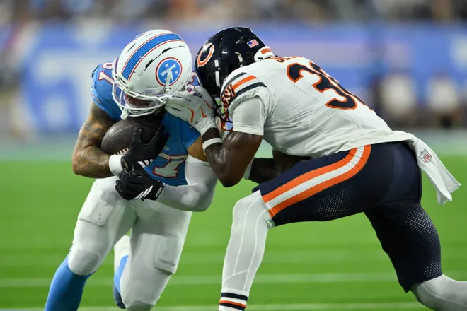 Aug 29, 2026; Nashville, Tennessee, USA;  Chicago Bears running back Salvon Ahmed (36) tackles Tennessee Titans wide receiver Xavier Restrepo (87) during the fourth quarter at Nissan Stadium.  Mandatory Credit: Steve Roberts-Imagn Images