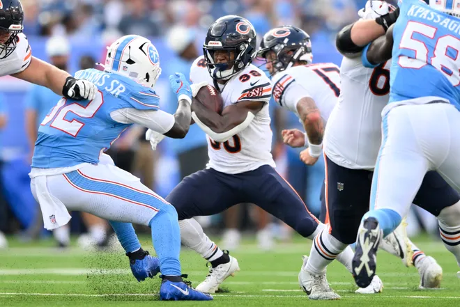 Aug 29, 2026; Nashville, Tennessee, USA;  Chicago Bears running back Brittain Brown (38) runs against Tennessee Titans running back Nicholas Singleton (32) during the second quarter at Nissan Stadium.  Mandatory Credit: Steve Roberts-Imagn Images
