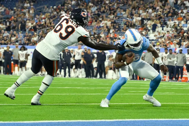 Aug 29, 2026; Nashville, Tennessee, USA;  Chicago Bears defensive end Jeremiah Martin (69) tackles Tennessee Titans quarterback Hendon Hooker (16) during the fourth quarter at Nissan Stadium.  Mandatory Credit: Steve Roberts-Imagn Images