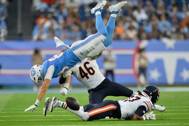 Aug 29, 2026; Nashville, Tennessee, USA;  Tennessee Titans tight end Joel Wilson (83) forces Chicago Bears linebacker Jon Rhattigan (46) to fumble during the third quarter at Nissan Stadium.  Mandatory Credit: Steve Roberts-Imagn Images