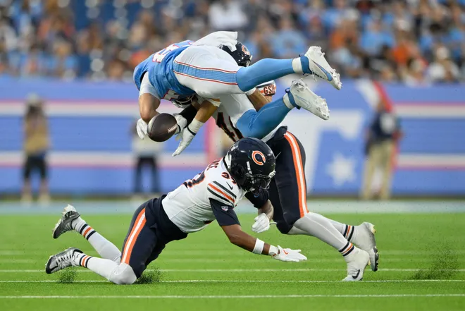 Aug 29, 2026; Nashville, Tennessee, USA;  Tennessee Titans tight end Joel Wilson (83) forces Chicago Bears linebacker Jon Rhattigan (46) to fumble during the third quarter at Nissan Stadium.  Mandatory Credit: Steve Roberts-Imagn Images
