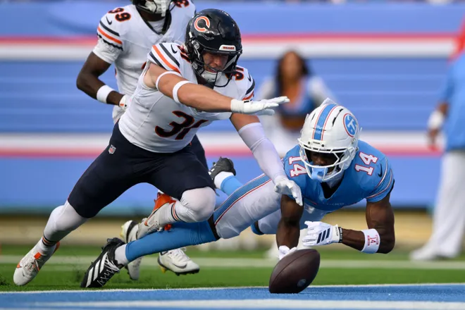 Aug 29, 2026; Nashville, Tennessee, USA;  Chicago Bears safety Dillon Thieneman (31) breaks up a pass intended for Tennessee Titans wide receiver Carnell Tate (14) in the first quarter at Nissan Stadium.  Mandatory Credit: Steve Roberts-Imagn Images