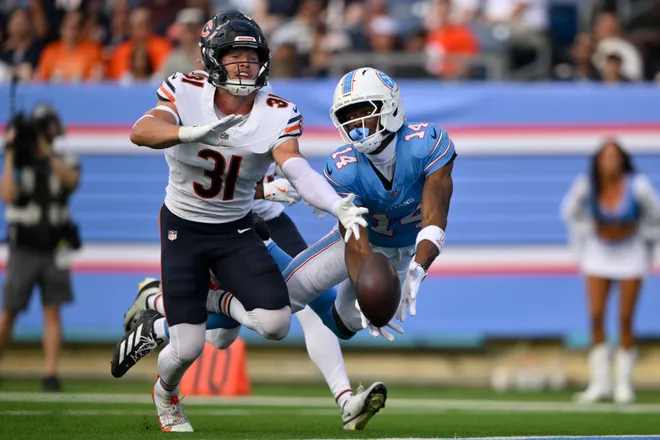 Aug 29, 2026; Nashville, Tennessee, USA;  Chicago Bears safety Dillon Thieneman (31) breaks up a pass intended for Tennessee Titans wide receiver Carnell Tate (14) in the first quarter at Nissan Stadium.  Mandatory Credit: Steve Roberts-Imagn Images
