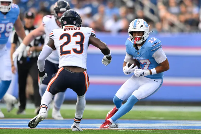 Aug 29, 2026; Nashville, Tennessee, USA;  Tennessee Titans wide receiver Chimere Dike (17) runs against
Chicago Bears safety Xavier Woods (23) during the first quarter at Nissan Stadium.  Mandatory Credit: Steve Roberts-Imagn Images