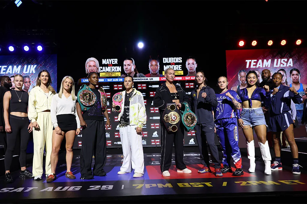 The full MVPW-06 UK vs. USA card on stage at the weigh-in, with Team UK and Team USA panels on either side