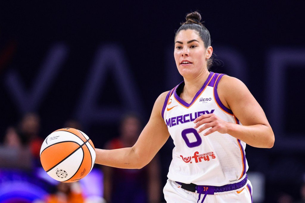Kelsey Plum dribbles the basketball while playing against the Washington Mystics.