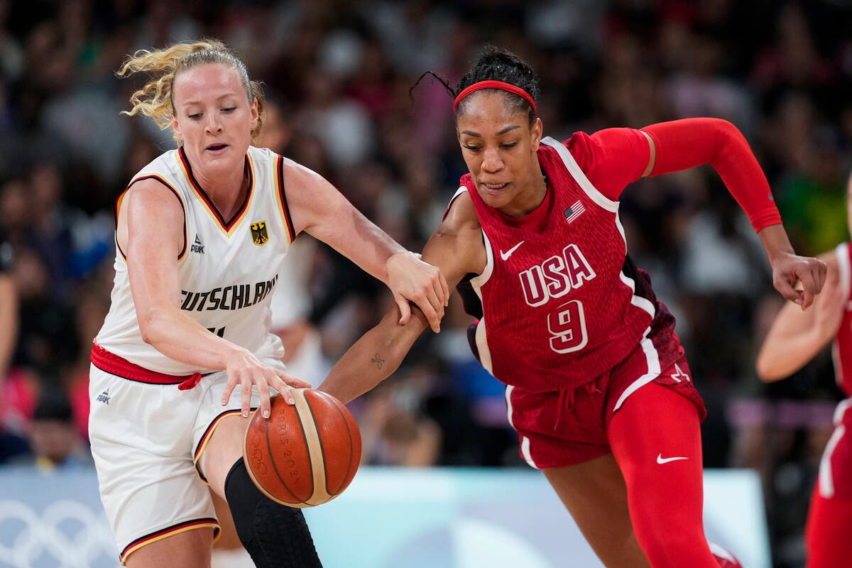 Marie Guelich (11), of Germany, tries to stop A'ja Wilson (9), of the United States, in a ...