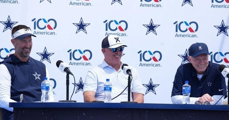 Jul 28, 2026; Oxnard, CA, USA; Dallas Cowboys coach Brian Schottenheimer (left), executive vice president Stephen Jones (center) and owner Jerry Jones at training camp opening press conference at River Ridge Playing Fields. Mandatory Credit: Kirby Lee-Imagn Images | State