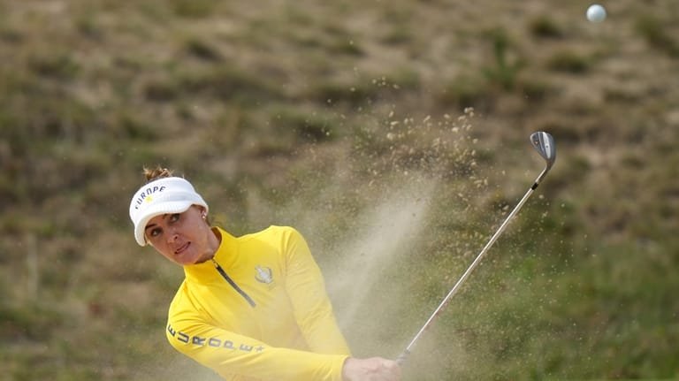 Charley Hull of Europe plays from a bunker near the...
