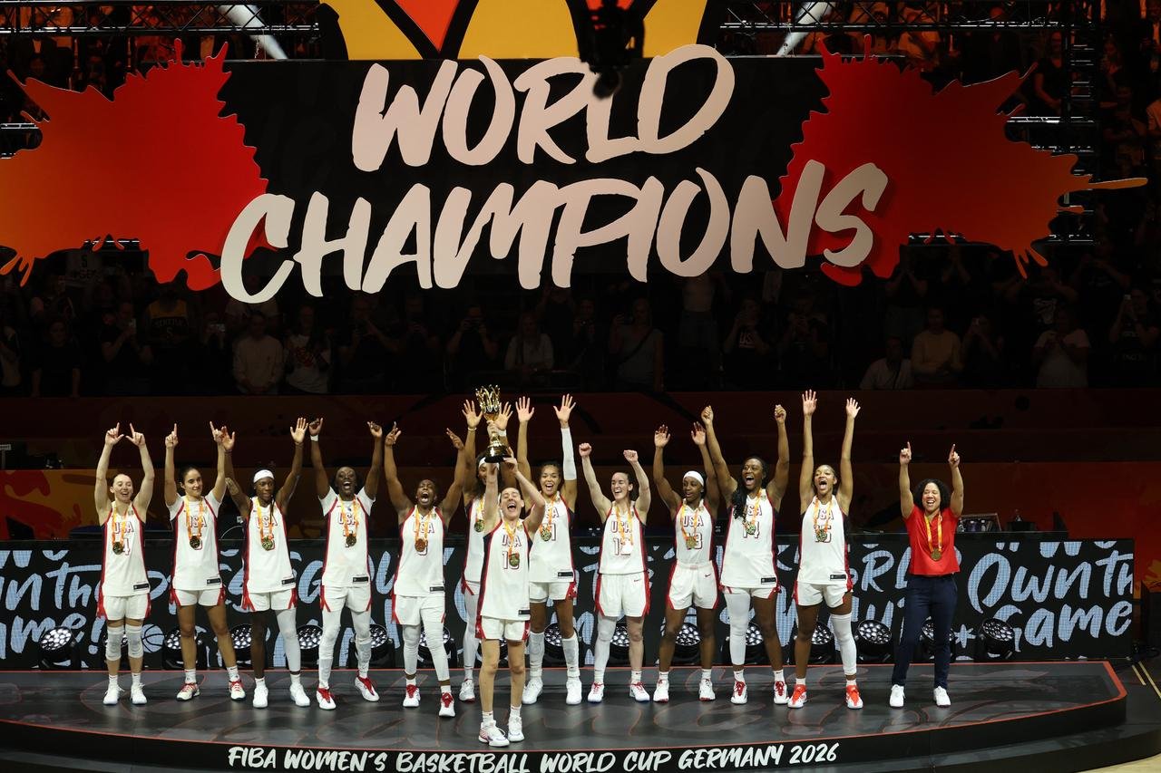 US’ players celebrate with the trophy after winning the 2026 FIBA Women’s Basketball World Cup final game against France in Berlin on September 13, 2026. (AFP Photo)