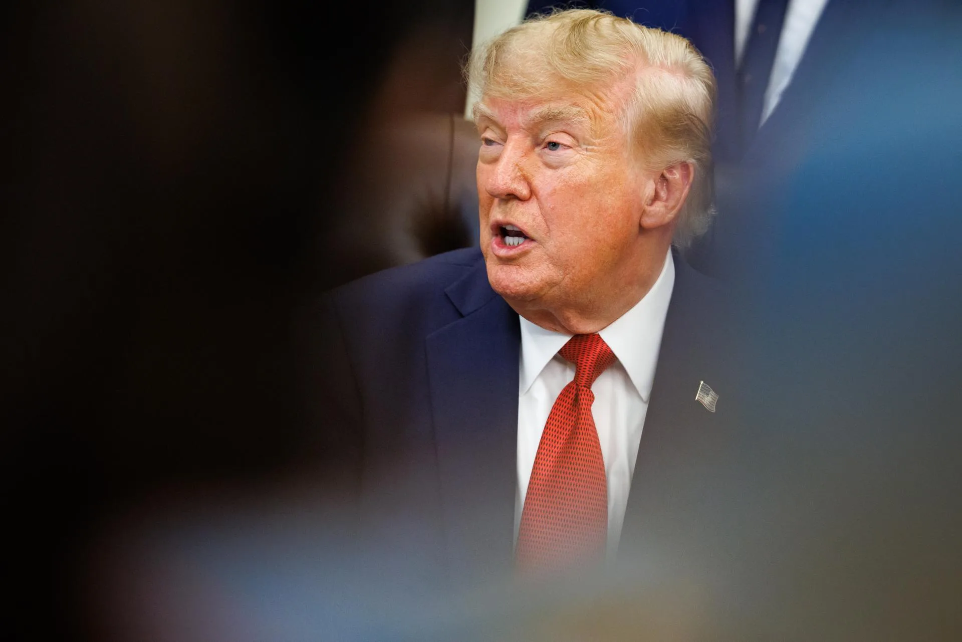 Trump signs new sanctions on Russia, and Iran
