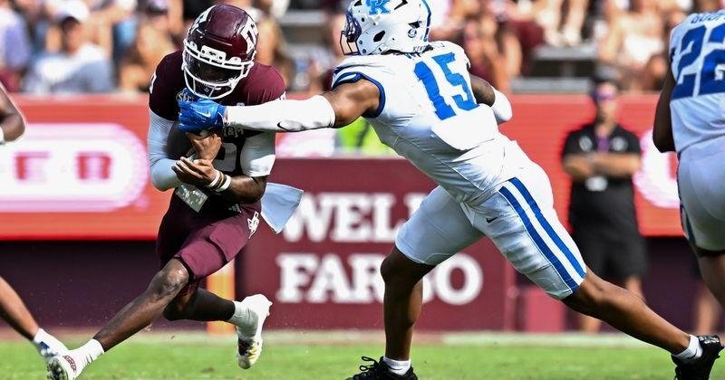 Sep 19, 2026; College Station, Texas, USA; Kentucky Wildcats linebacker Cedric Works (15) tackles Texas A&M Aggies quarterback Marcel Reed (10) during the third quarter at Kyle Field. Mandatory Credit: Maria Lysaker-Imagn Images | Texas