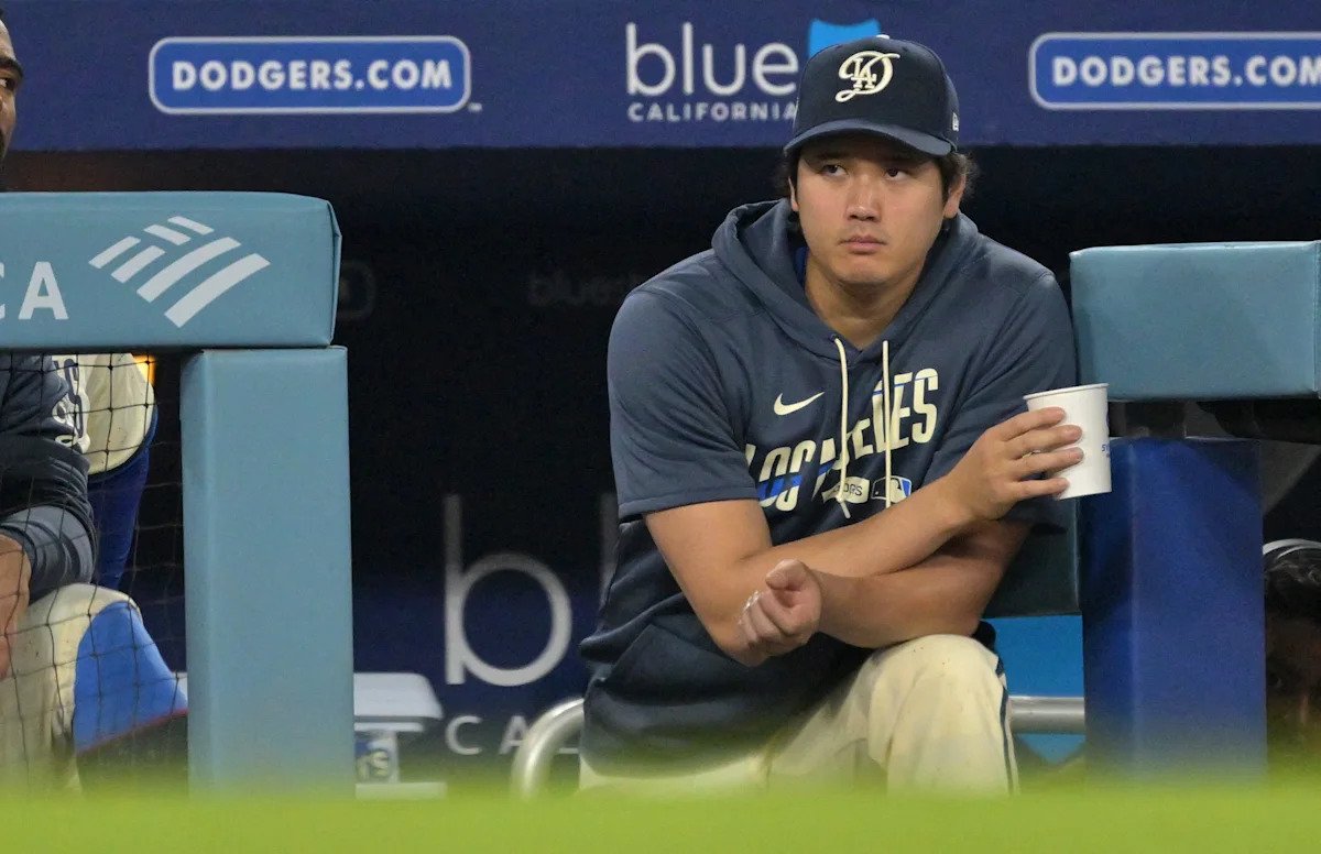 The Los Angeles Dodgers' Shohei Ohtani looks on from dugout during a game against the San Francisco Giants at Dodger Stadium on Sept. 19, 2026.