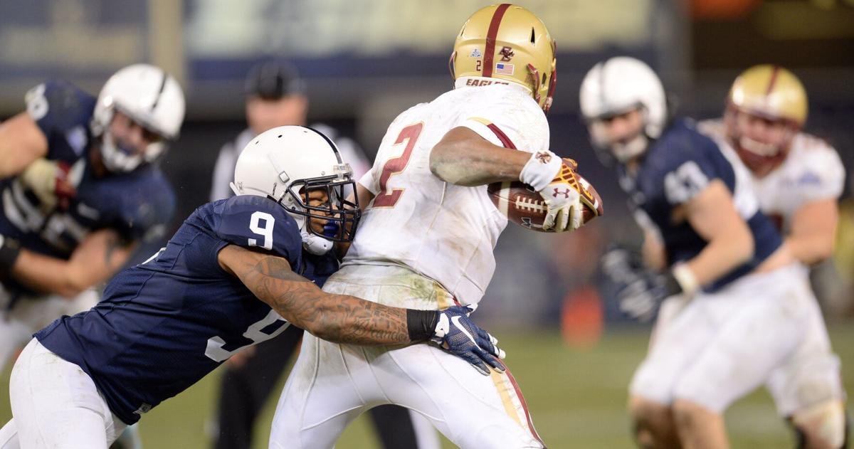 Dec 27, 2014; Bronx, NY, USA; Penn State Nittany Lions cornerback Jordan Lucas (9) tackles Boston College Eagles quarterback Tyler Murphy (2) during the second half of the 2014 Pinstripe Bowl at Yankee Stadium. Penn State won 31-30 in overtime. Mandatory C