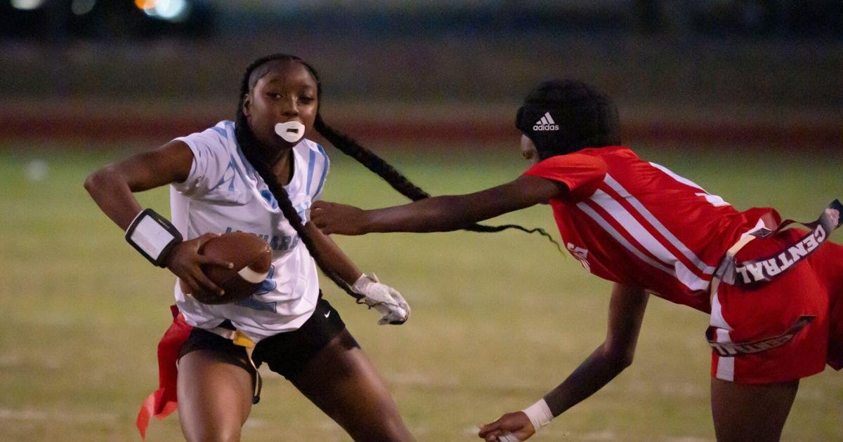 Oct. 2, 2025; Tuscaloosa, Alabama, USA; Northridge's Jiayiah Lee (2) tries to evade a flag pull by Central's Alaysha Merriweather (5) at Central High School.