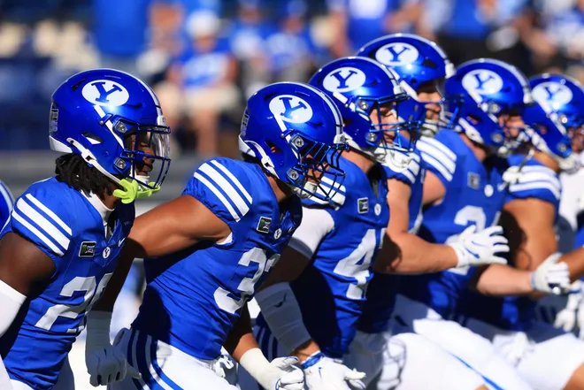 Sep 5, 2026; Provo, Utah, USA;  BYU Cougars players warm up before a game against the Utah Tech Trailblazers at LaVell Edwards Stadium.  Mandatory Credit: Rob Gray-Imagn Images