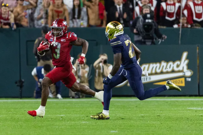 Sep 6, 2026; Green Bay, Wisconsin, USA;  Wisconsin Badgers running back Abu Sama III (3) rushes the ball against the Notre Dame Fighting Irish in the first half at Lambeau Field.  Mandatory Credit: Trevor Ruszkowski-Imagn Images