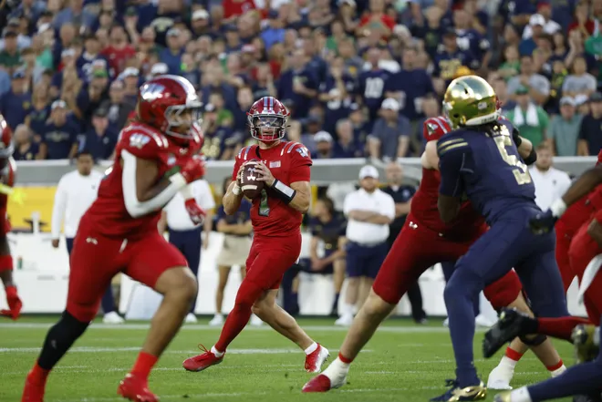 Sep 6, 2026; Green Bay, Wisconsin, USA;  Wisconsin Badgers quarterback Colton Joseph (1) drops back to pass in the first half at Lambeau Field.  Mandatory Credit: Michael Caterina-Imagn Images