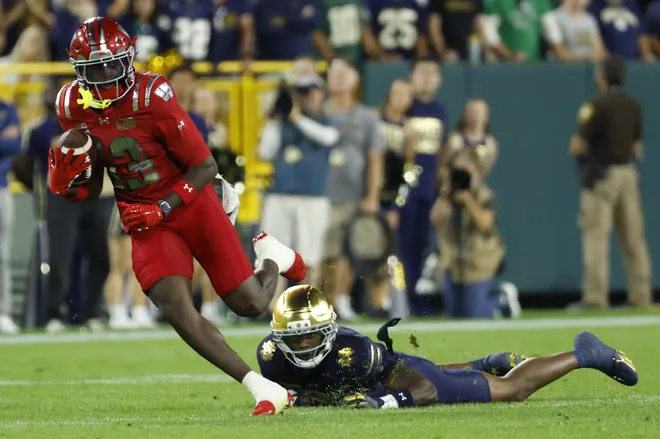 Sep 6, 2026; Green Bay, Wisconsin, USA;  Wisconsin Badgers wide receiver Eugene Hilton Jr. (13) makes a catch against the Notre Dame Fighting Irish in the first half at Lambeau Field.  Mandatory Credit: Michael Caterina-Imagn Images