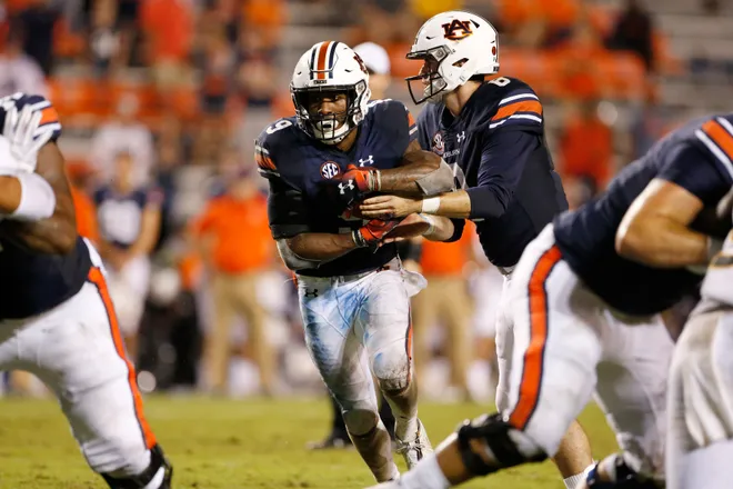 Sep 29, 2018; Auburn, AL, USA; Auburn Tigers running back Kam Martin (9) takes the handoff from quarterback Jarrett Stidham (8) against the Southern Miss Golden Eagles in the fourth quarter at Jordan-Hare Stadium. Mandatory Credit: John Reed-USA TODAY Sports