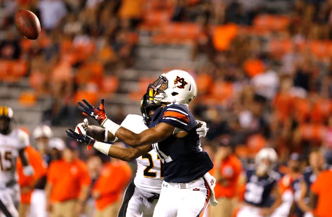 Sep 29, 2018; Auburn, AL, USA; Auburn Tigers receiver Darius Slayton (81) makes a catch as Southern Miss Golden Eagles defensive back Rachuan Mitchell (21) defends during the third quarter at Jordan-Hare Stadium. Mandatory Credit: John Reed-USA TODAY Sports