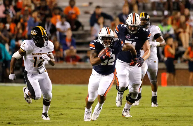 Sep 29, 2018; Auburn, AL, USA; Auburn Tigers running back Malik Miller (32) carries as Southern Miss Golden Eagles defensive back Delmond Landry (17) closes in during the third quarter at Jordan-Hare Stadium. Mandatory Credit: John Reed-USA TODAY Sports