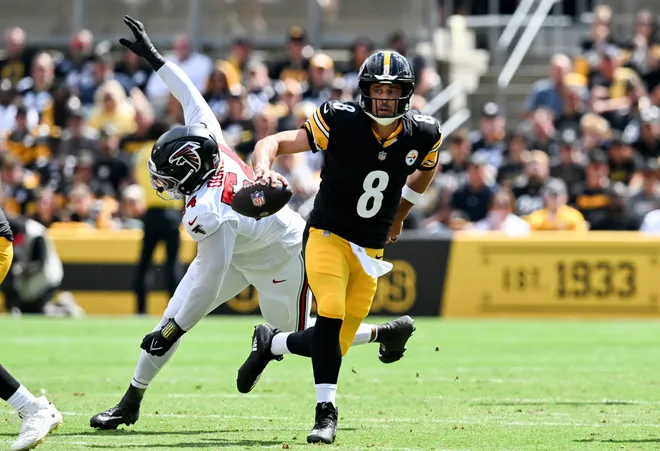 Sep 13, 2026; Pittsburgh, Pennsylvania, USA;  Pittsburgh Steelers quarterback Aaron Rodgers (8) scrambles past Atlanta Falcons defensive line Brandon Dorlus (54) during the first quarter at Acrisure Stadium.  Mandatory Credit: Barry Reeger-Imagn Images